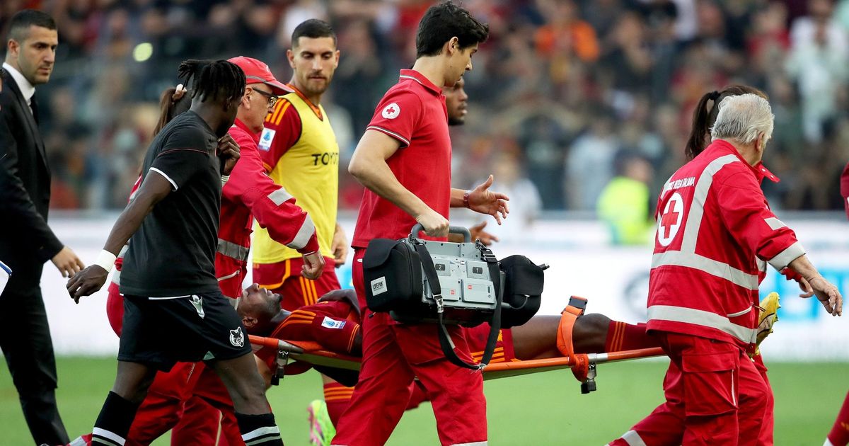 Serie A match in Rome abandoned after Evan Ndicka collapses on pitch and is rushed to hospital